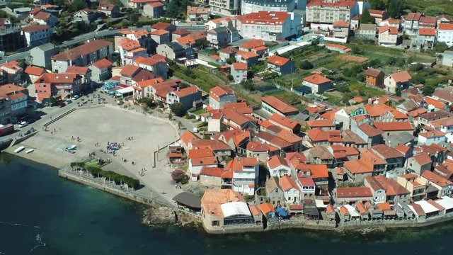 Aerial footage of a square in the town of Combarro, Spain, on a calm day