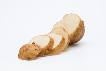 Raw cut potato on white background