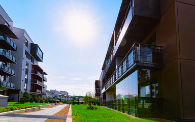 Fototapeta premium Apartment in residential building exterior. Housing structure at blue modern house of Europe. Rental home in city district on summer. Architecture for business property investment, Vilnius, Lithuania.