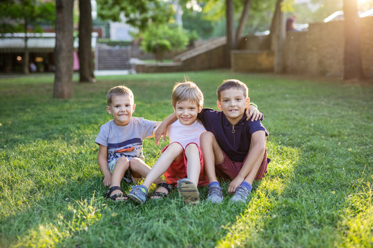 Three Happy Young Boys In Summer Park