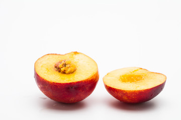 Sliced peaches on a white background
