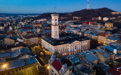 View on Lviv city hall at night from drone