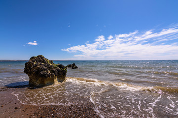 Landscape view of rocks on the beach against sea in Puerto Madryn, Patagonia, Argentina