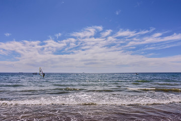 Seascape view person practicing windsurfing on the sea in Puerto Madryn, Patagonia, Argentina