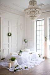 Bedroom decoration in soft white tones with candles