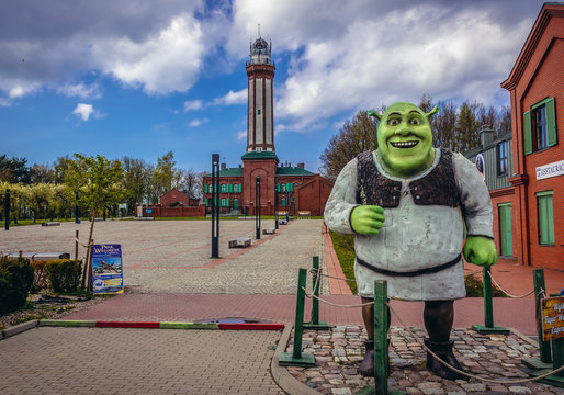 Niechorze, Poland - May 11, 2017: Shrek figure on the square in front of lighthouse in Niechorze, small village on the Baltic Sea coast