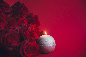 Valentine's day background, red roses with aroma candle