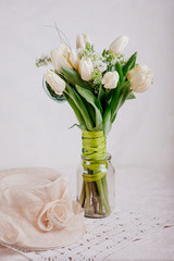 Bouquet of white tulips with lilac in vase