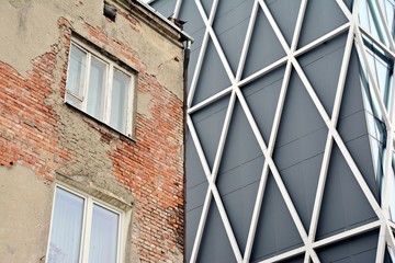 Abstract image of looking up at modern glass and concrete building. Architectural exterior detail of office building. 