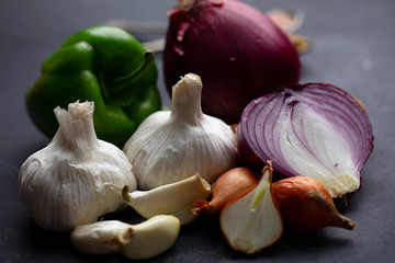 fresh food materials. garlic, purple onion, pepper, shallots