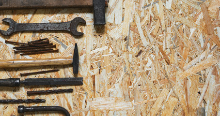Concept for happy father's day holiday greetings. Old carpenter construction tools on a wooden...