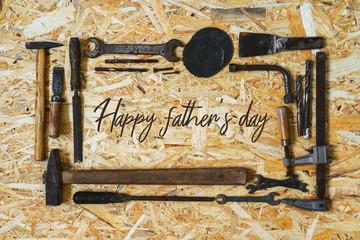 Concept for the Happy Father's Day holiday. Old vintage carpenter's construction tools on a wooden...