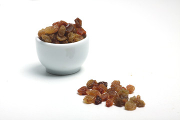 a bowl of raisin isolated on white background. Horizontal image