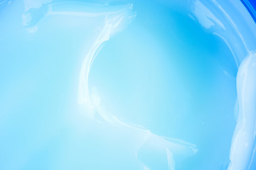 The creamy texture of the blue color. Cosmetic trendy background. macro.