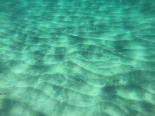 underwater scene with rays of light on a beach on the island of Mallorca	