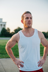 Handsome Caucasian man portrait while resting during a workout outdoors at the National Mall in Washington DC - 313155256