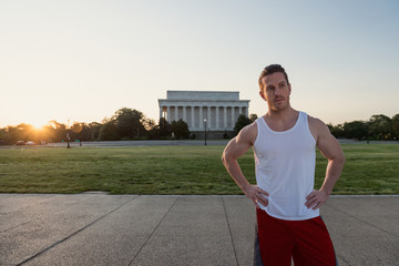 Handsome Caucasian man portrait while resting during a workout outdoors at the National Mall in Washington DC - 313155475