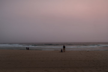 Fototapeta na wymiar Sydney's Bronte Beach with tourists waiting for dawn
