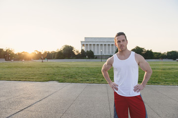 Handsome Caucasian man portrait while resting during a workout outdoors at the National Mall in Washington DC