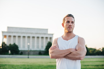 Handsome Caucasian man portrait while resting during a workout outdoors at the National Mall in Washington DC - 313155613