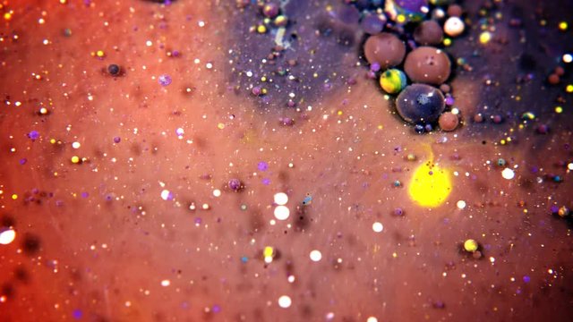 Abstract Colorful Acrylic Paint Sphere Spreads on Water