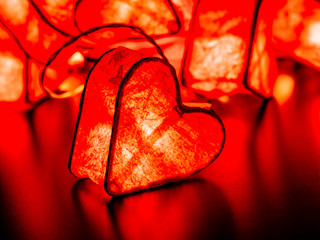 Close up of glowing red valentine heart decoration light