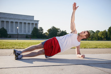 Fit Caucasian man doing exercise routine in the early morning near the Lincoln Memorial in Washington DC - 313156613