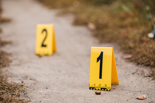 Crime scene with yellow signs.