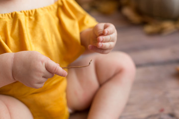 yellow autumn leaf in the hands of a child