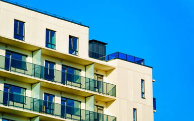 Apartment in residential building exterior. Housing structure at blue modern house of Europe. Rental home in city district on summer. Architecture for business property investment, Vilnius, Lithuania.