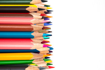 Colored wooden pencils on a white background.