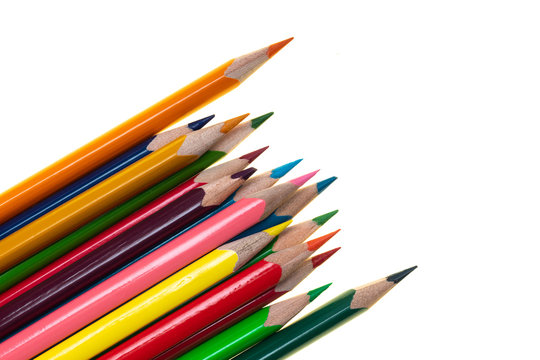 Colored wooden pencils on a white background.