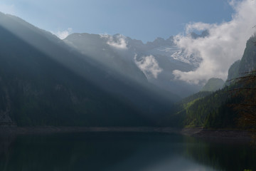 sun beams on dachstein glaciers and lake gosau