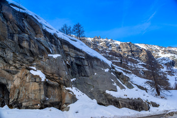 alpine panorama, snowy mountains with blue sky