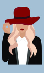 beautiful stylish blonde girl with red lips in a hat and suit