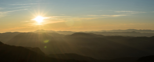 Panoramic view of a winter sunset above the mountain 