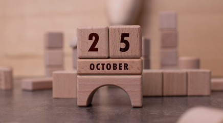 October 25 written with wooden blocks