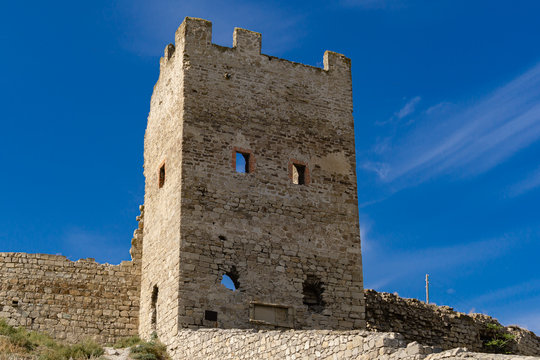 Scenic view of fortification walls of medieval Genoese fortress on Black Sea coast in the southern part of Feodosia city. Feodosia, Crimea, Russia - September, 2019