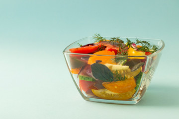Fresh vegetable salad  in a glass bowl.