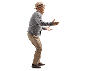Senior gentleman gesturing with hands and playing a game