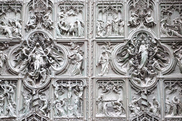 Gothic statues on the wall. Milan, Italy