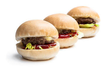 Set of three mini hamburgers isolated on white background