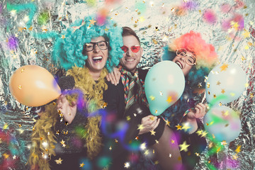 party group with wig and streamers on carnival 