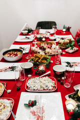 Christmas dinner table with traditional Turkish Cuisine food and red new year concept. 