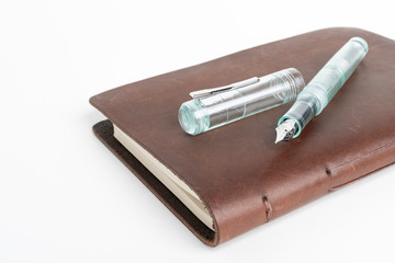 Brown Leather Journal And Green Glass Fountain Pen