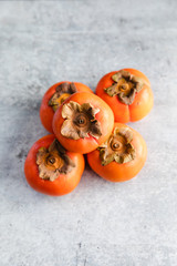 Ripe Fuyu Persimmon Isolated on Light Background, Isolated, Top View 