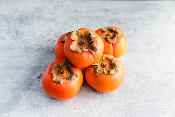 Ripe Fuyu Persimmon Isolated on Light Background, Isolated Closeup