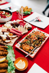 Christmas dinner table with traditional Turkish Cuisine food and red new year concept.	
