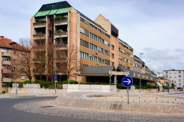 Cityscape with road and roundabout and house building in the center of Celje old town in Slovenia. Architecture in Slovenija.