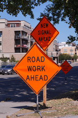 Road works. Road signs informing about a change in traffic organization.